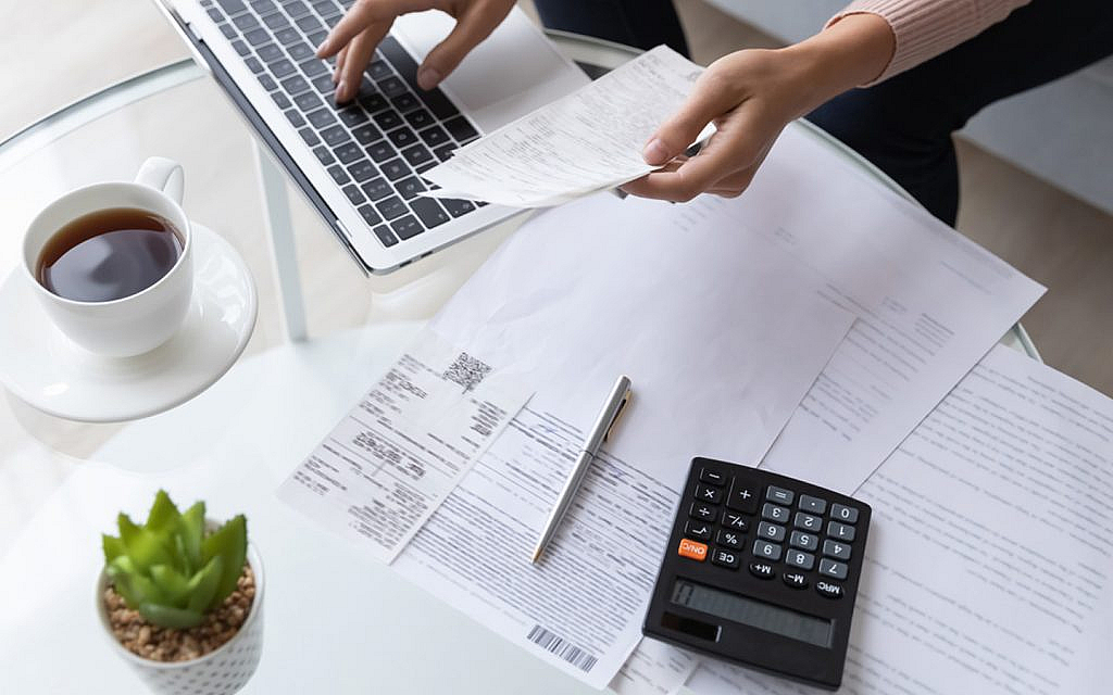 Woman reading paper that has tips to rent your house faster 