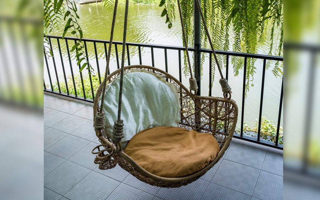 small balcony decoration ideas include installing an outdoor swing 