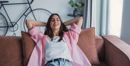 woman relaxing on sofa at home