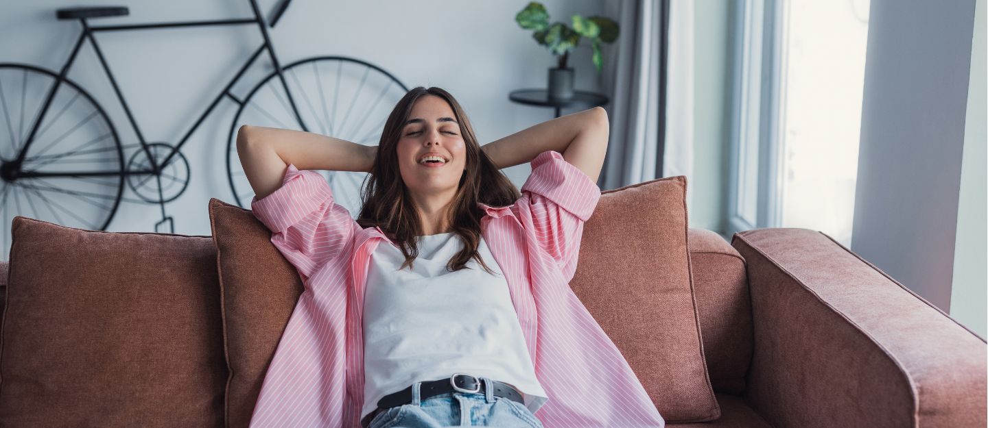 woman relaxing on sofa at home