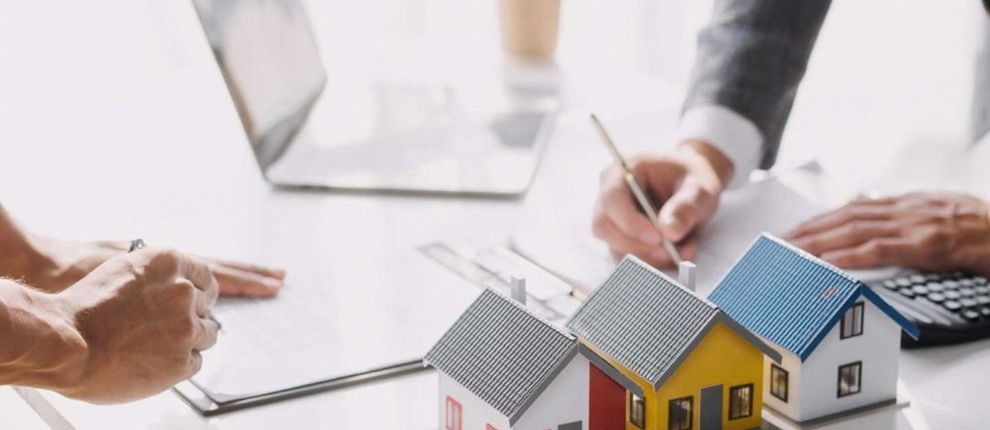 House models with documents for tenancy agreement.