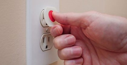 Child safety plug inserted into electrical outlet