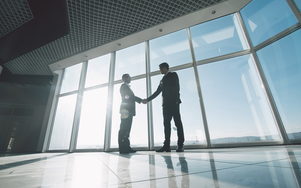 real estate agents shaking hands over a done deal