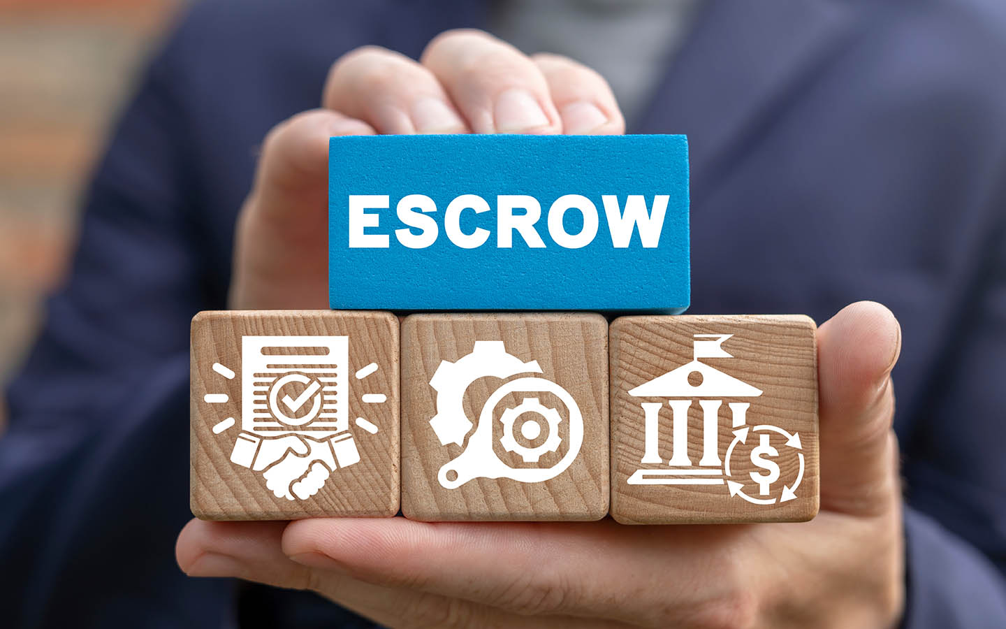 a man holding blocks of escrow account and its management