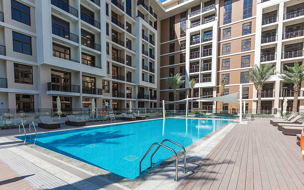 an apartment building with a swimming pool