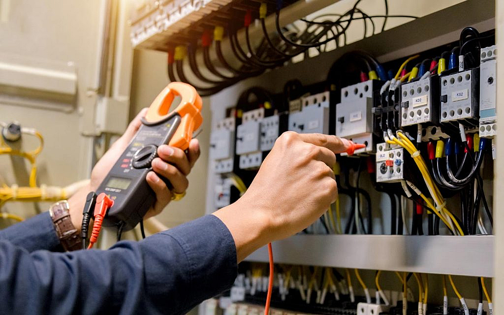 person is providing electricity fit-out connection in Dubai