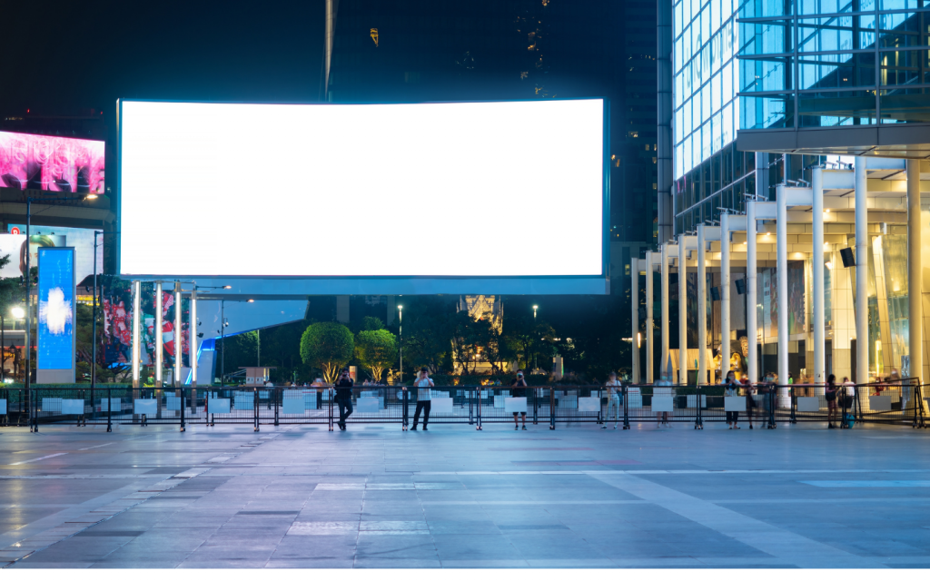 an empty billboard on a busy street that can be used to reduce administrative, marketing and Vat expenses