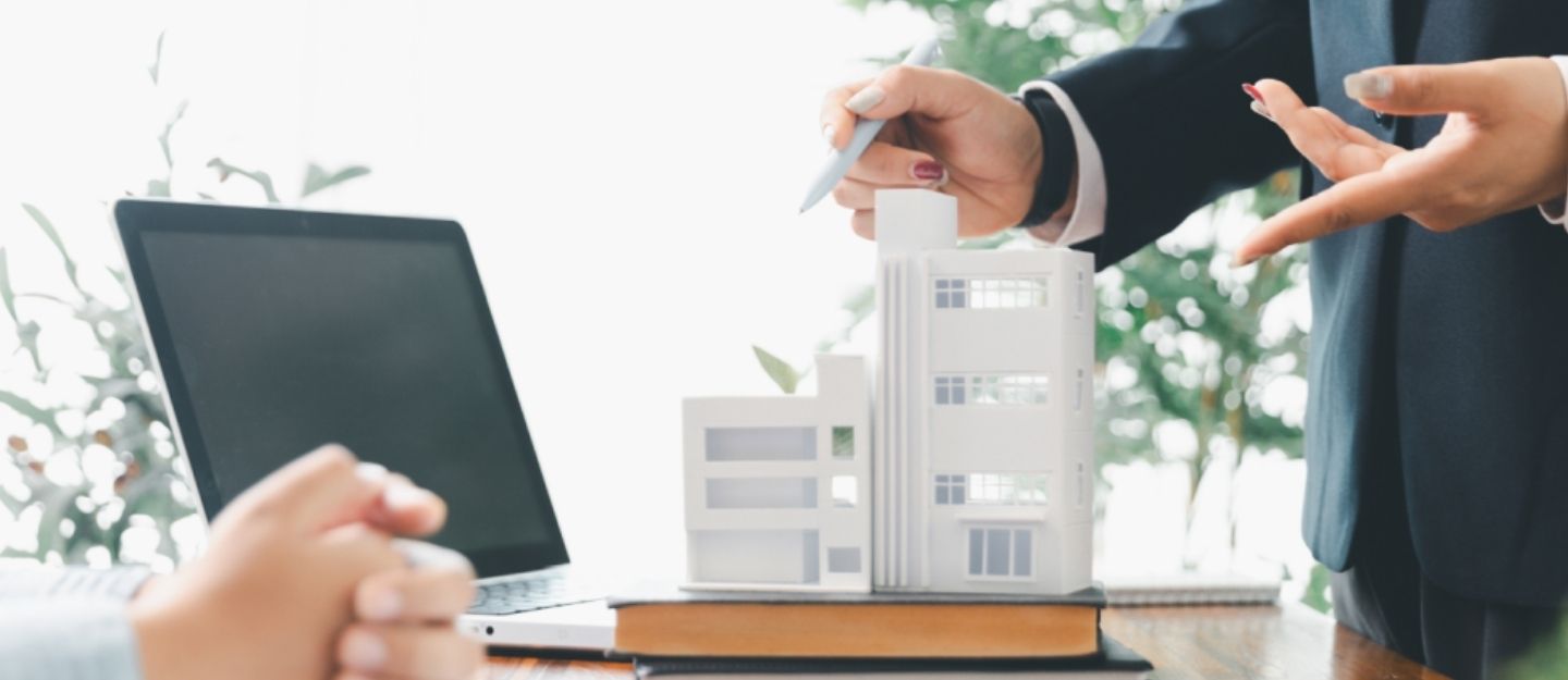 Woman explaining building structure