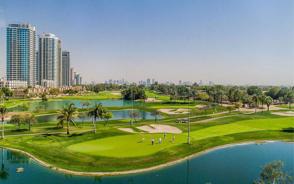 Benefits of living in DAMAC Hills 2 such as green spaces