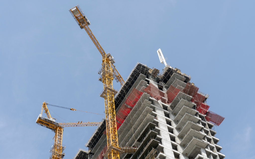 view of an under-construction building with crane 
