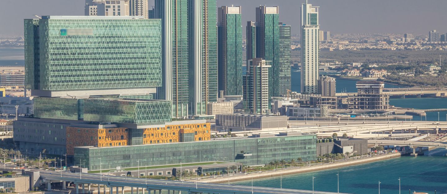 Modern waterfront city skyline with high-rise buildings.