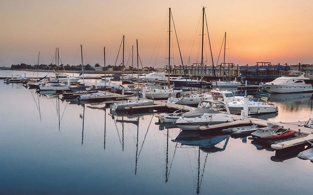 boats on the shore of al hamra village rak
