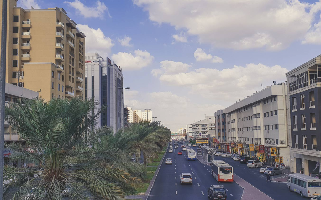 Buses and cars on the road of Al Qusais