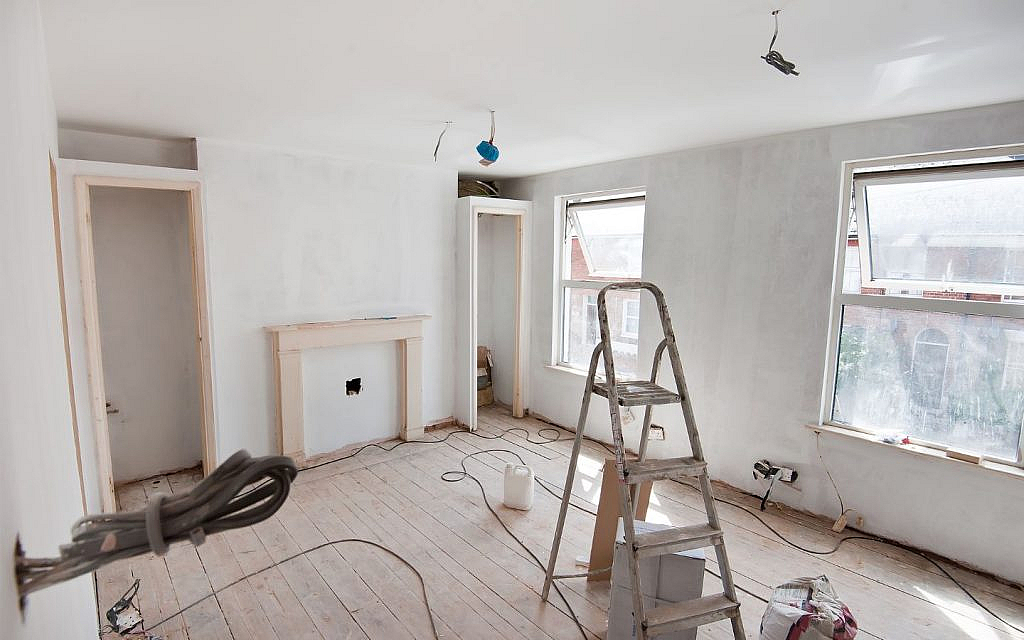 A stair palced in a centre of under-renovation room