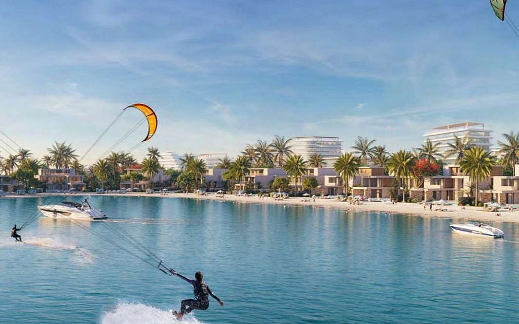 People doing kite surfing in a sea