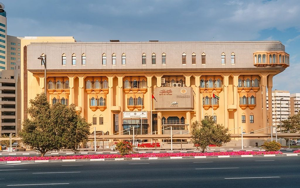 Front view of the DLD building next to a road