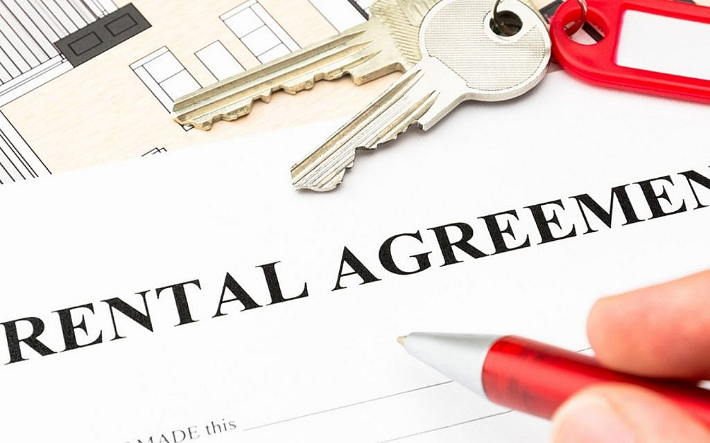 Rental agreement written on a white paper