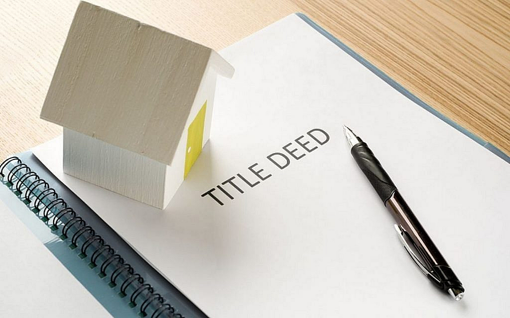 title deed written on a paper