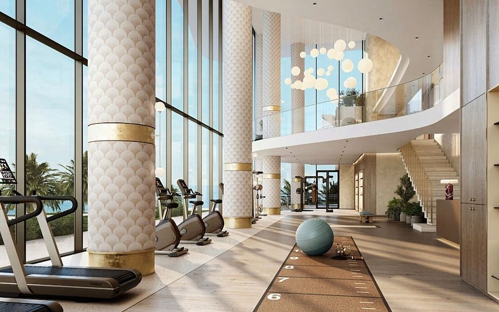 Modern fitness studio at The Mural by Beyond with state-of-the-art equipment and a sleek design.