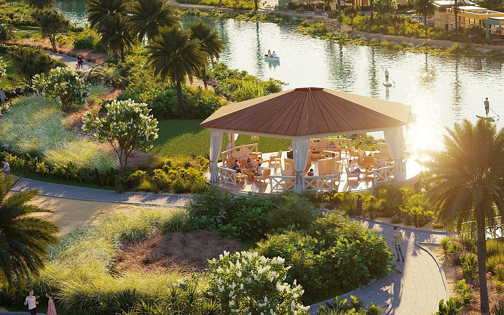 A recreational area in DAMAC Hills 2 surrounded by a garden