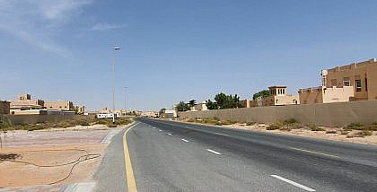 Street view of houses and desert landscape in Majan Dubai.