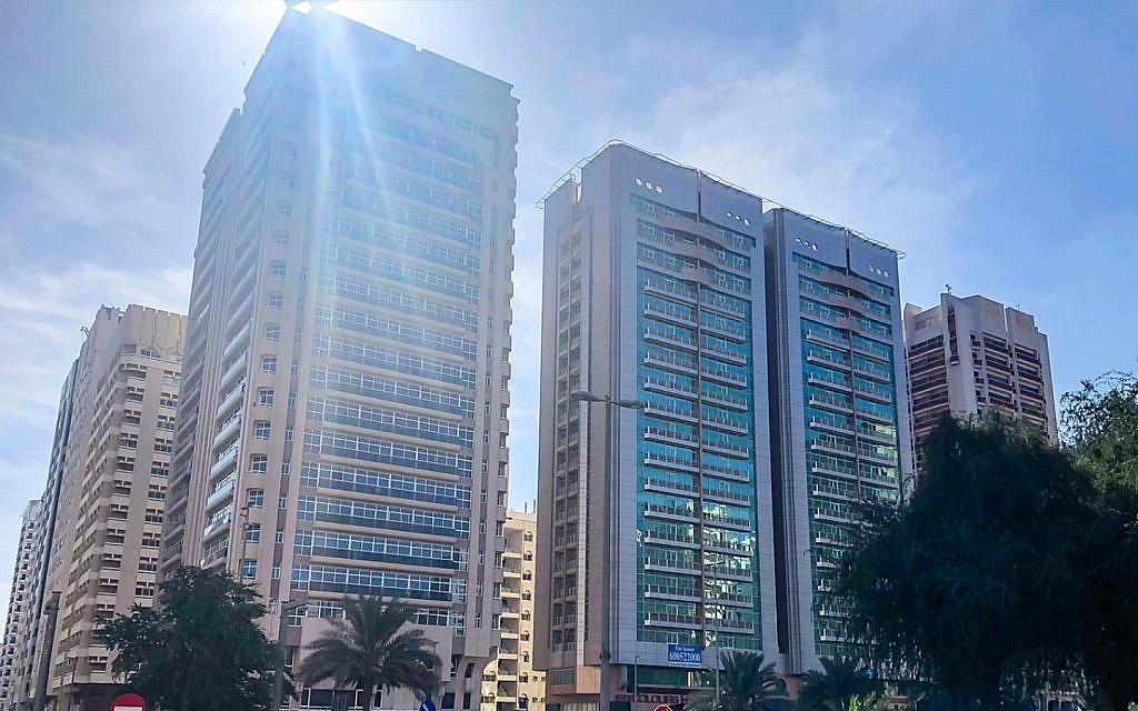 Blue glass facade of apartment complexes on Electra Street