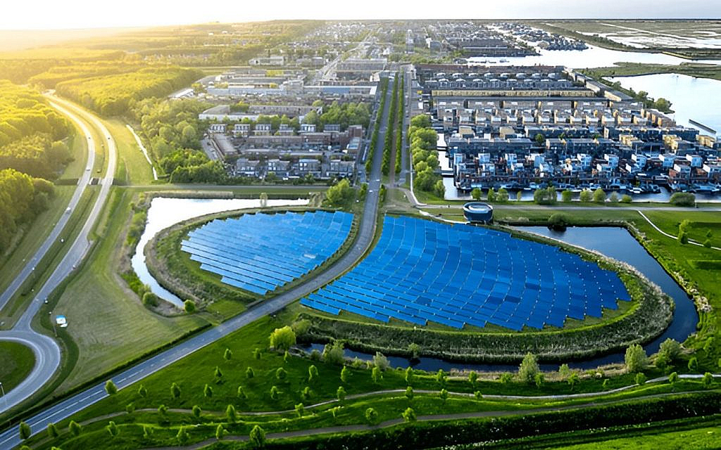 Aerial view of a green community with a large water conservatory