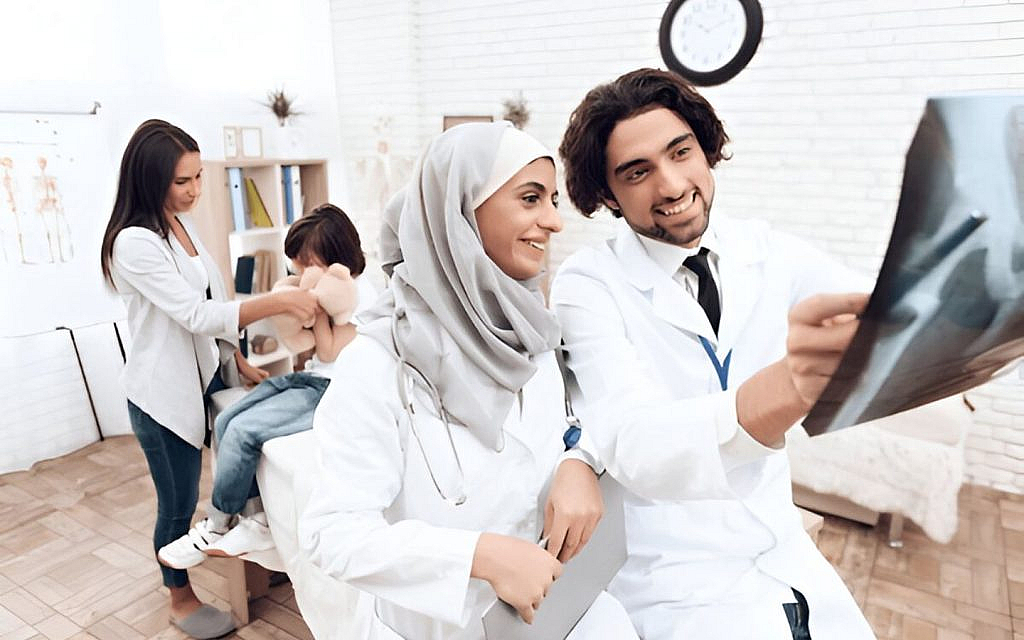 Doctors treating a patient in a hospital located in Nad Al Sheba