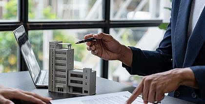 a person working on real estate syndication process