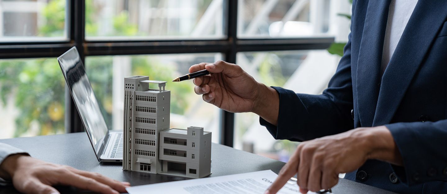 a person working on real estate syndication process