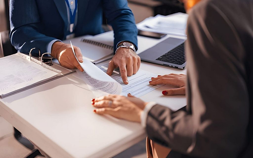 A man reviewing a lease contract