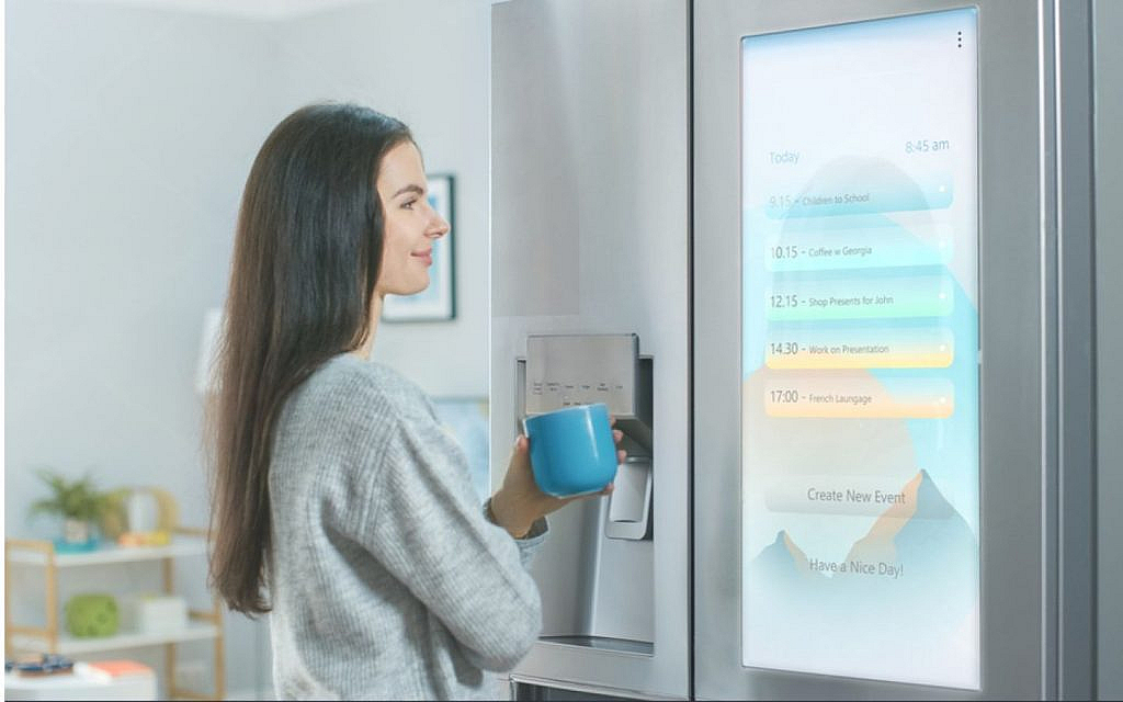 Women using an AI refrigerator for cooking