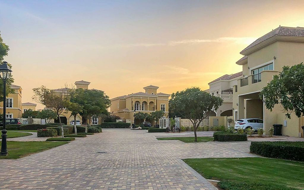 A cluster of yellow colour townhouses in Dubailand
