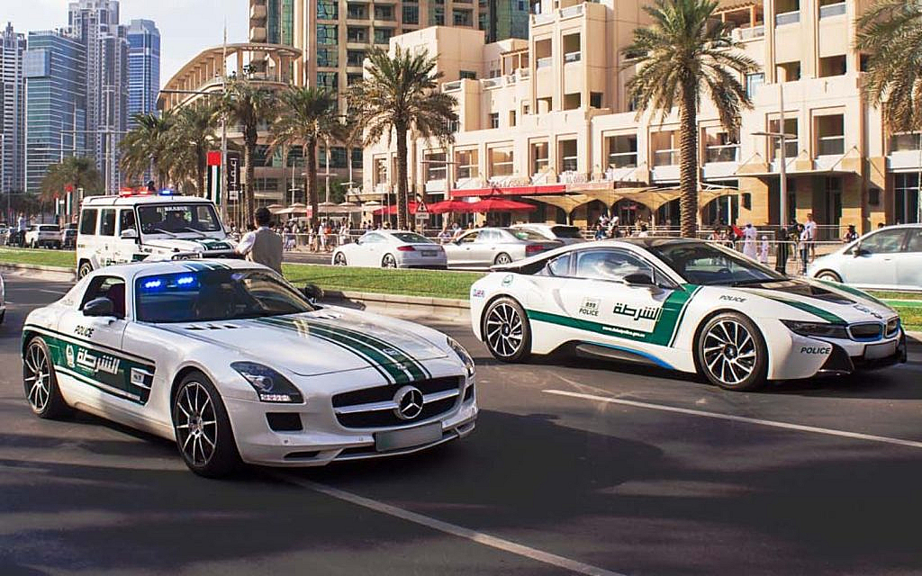 Dubai Police cars patrolling on the streets