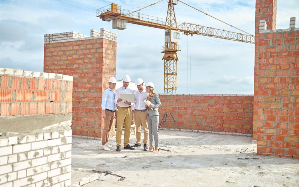 Developers and architects inspecting a site