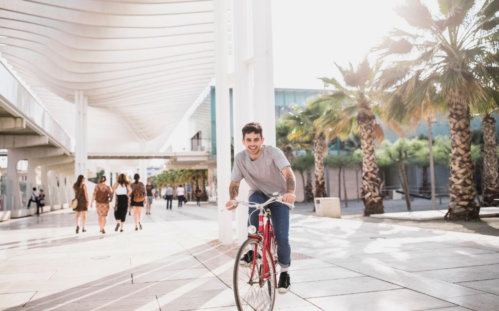 A man living in a 15-minute city cycling to work