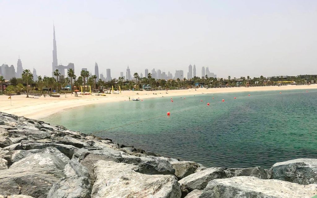 La Mer Beach with skyline of Dubai in the background