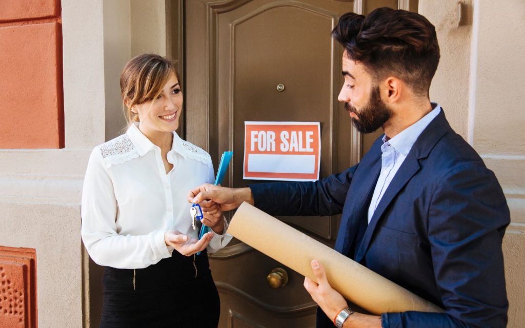 A buyer taking the keys to a property from the developer