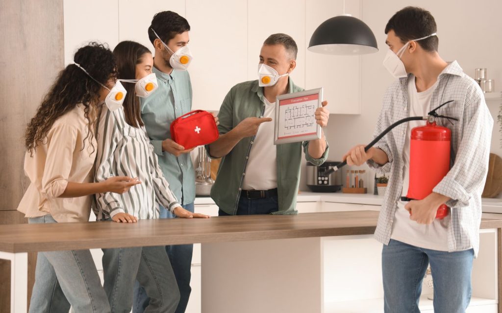 a person showing building evacuation plan in the UAE