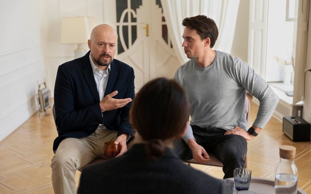 Mediator talking to parties involved in property disputes