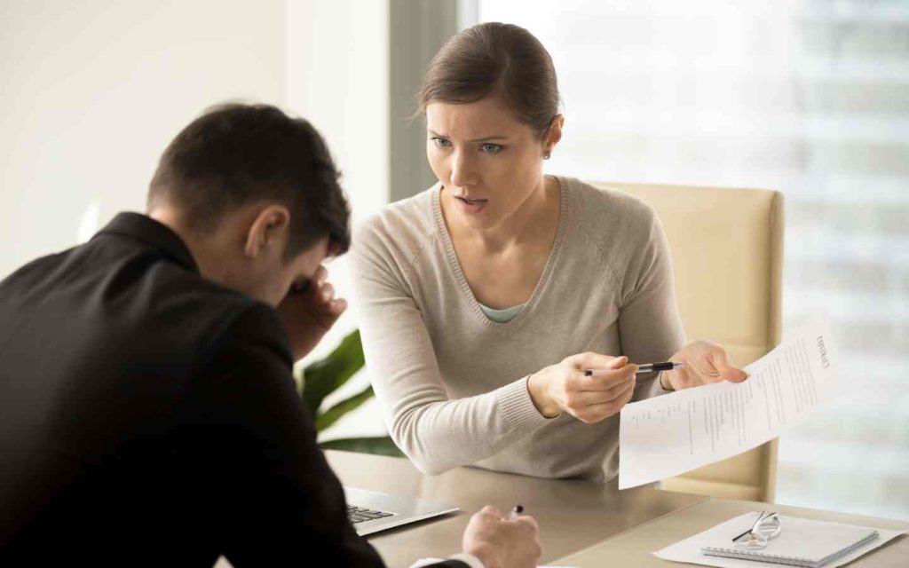 a man and a woman arguing over a contract