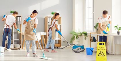 workers of a cleaning company in Ajman clearing the floor