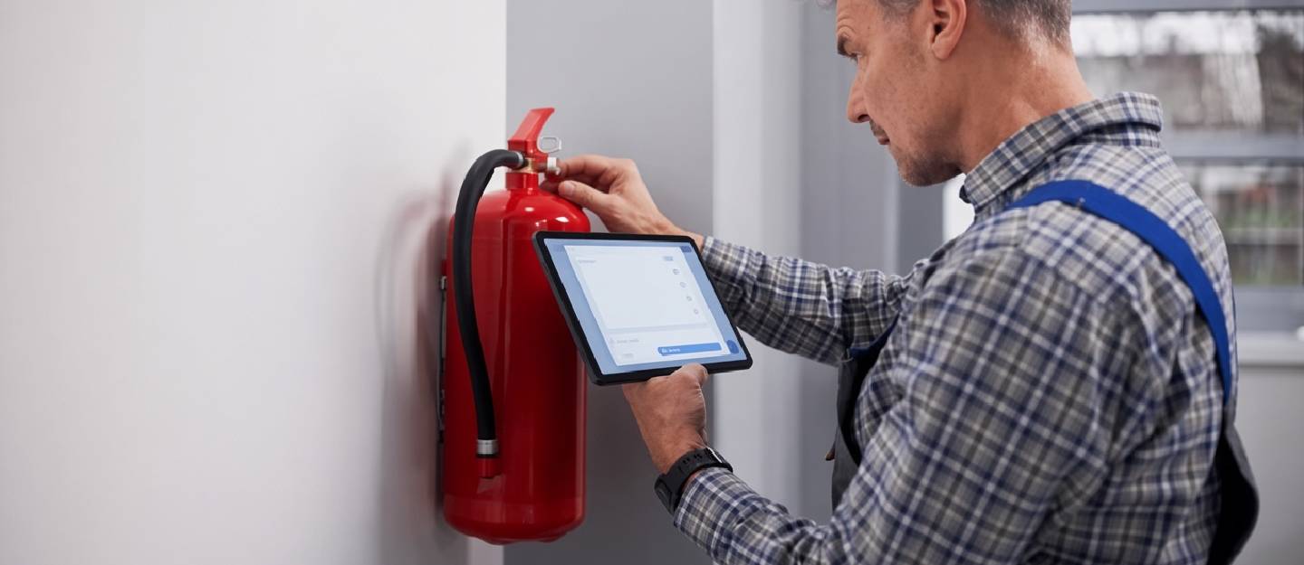 Man setting fire alarm system