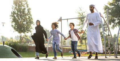 Family playing in a park in Dubai