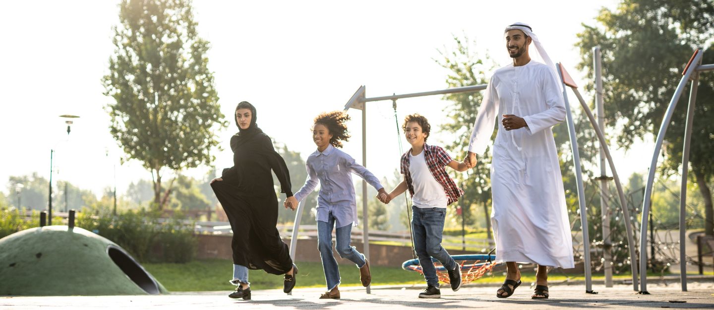 Family playing in a park in Dubai