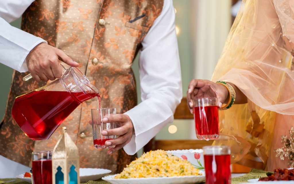 People setting up a dining area and serving drinks