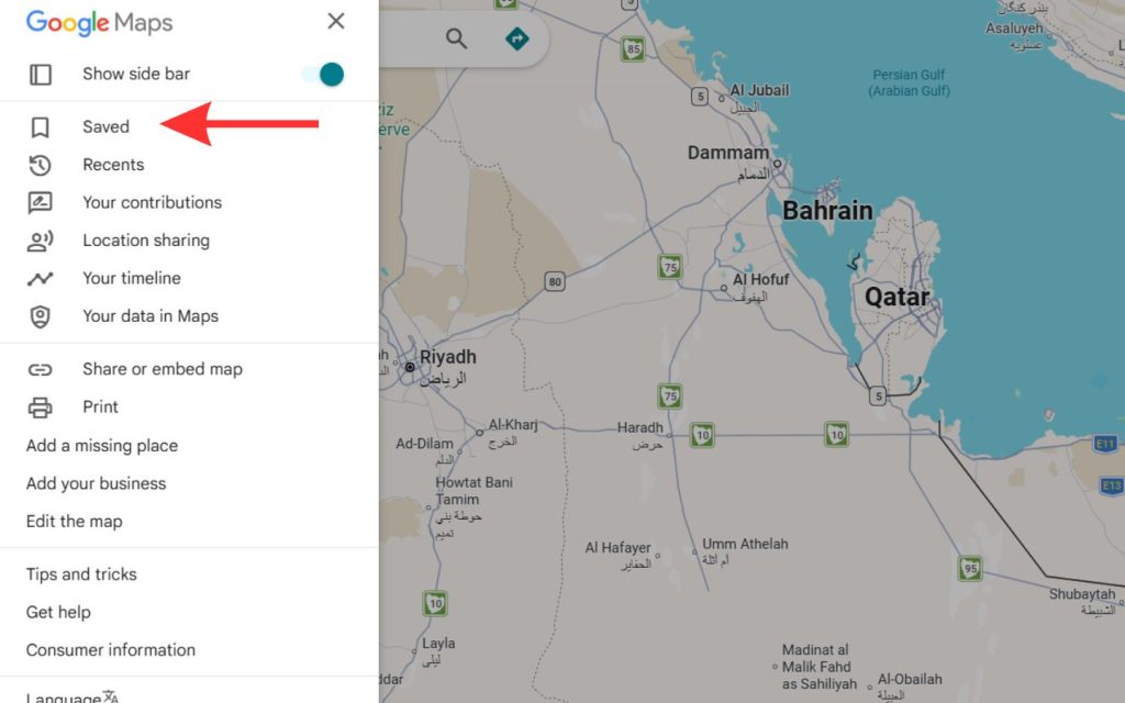 The Google Maps side menu on a desktop with a red arrow pointing toward the "Saved" section.