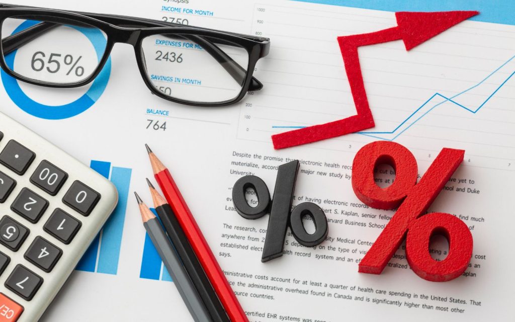 Symbol of percentage and spectacles over a paper
