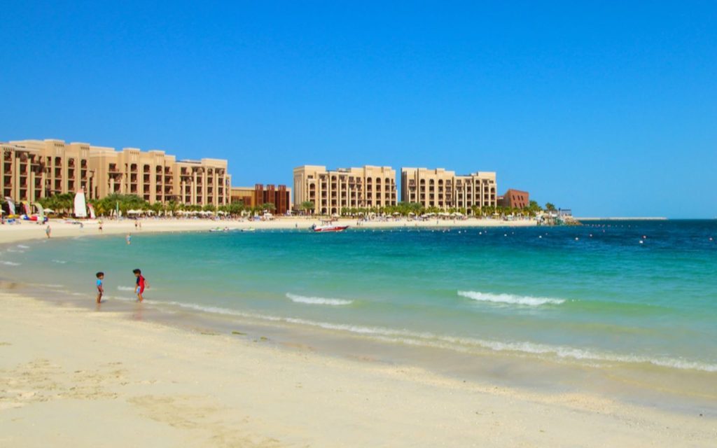 Children playing on the shore in Al Seer.