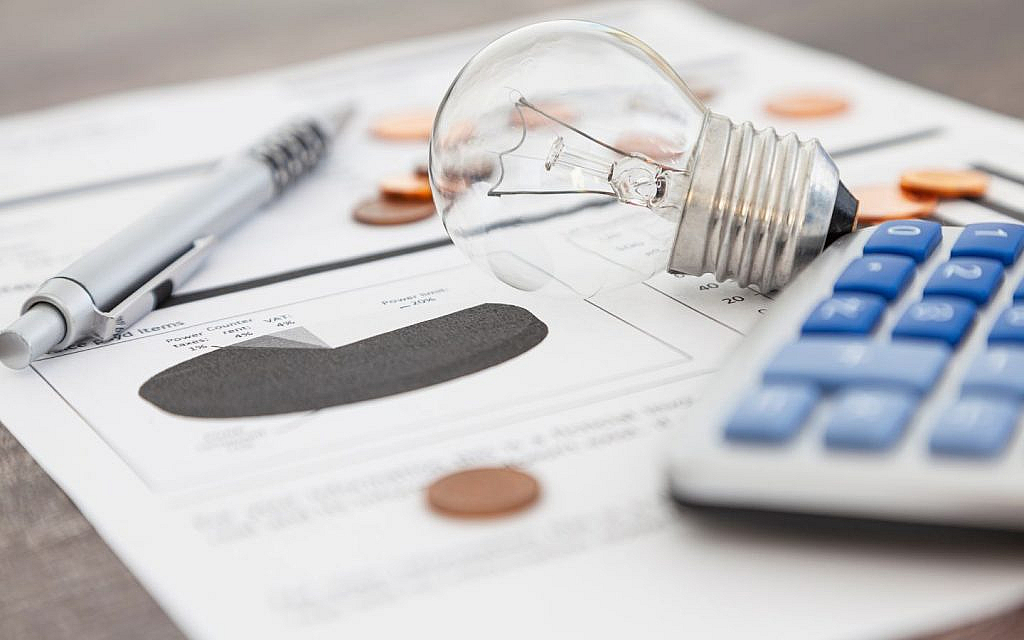 a utility bill with calculator and bulb